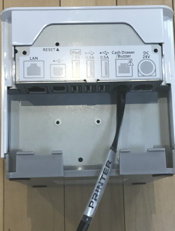The back of the Star Micronics Printer with the printer cable connected