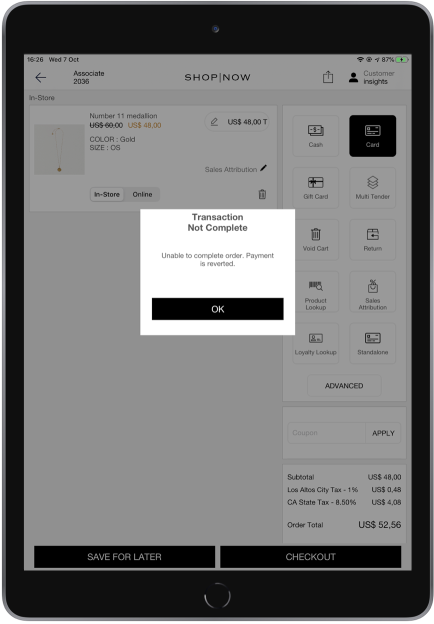 An iPad displays an online shopping cart with a notification that a transaction is not complete.