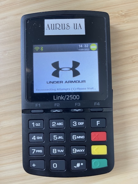 An Aurus terminal showing the Under Armour logo when you turn it on.