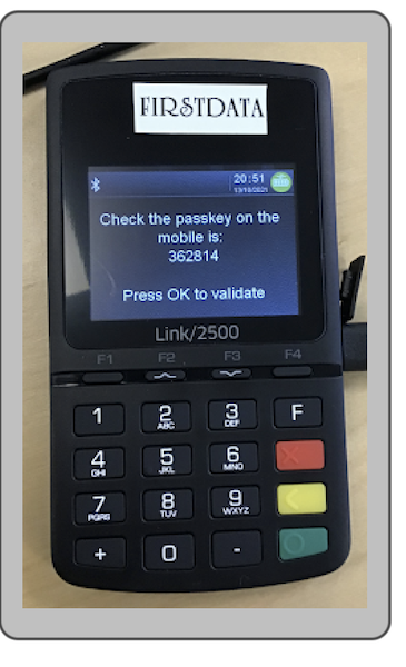 A confirmation message with a mobile passkey on the terminal screen.