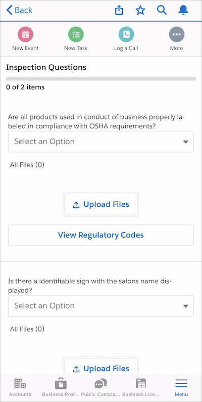 Inspection questions with Upload Files and View Regulatory Codes buttons in the mobile app