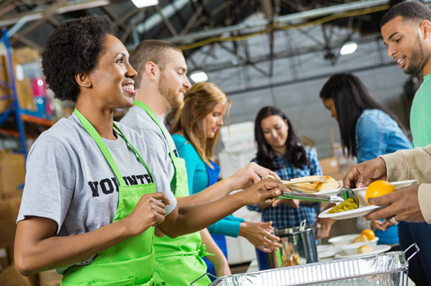 Volunteers in food service line